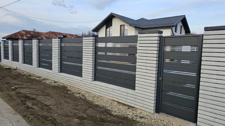 Gard din beton și metal pentru protecție și intimitate în curți private.